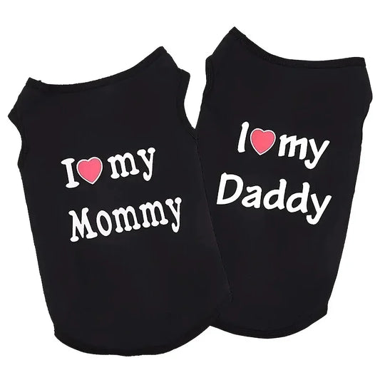 Two black pet shirts with 'I ❤️ my Mommy' and 'I ❤️ my Daddy' text on a white background.