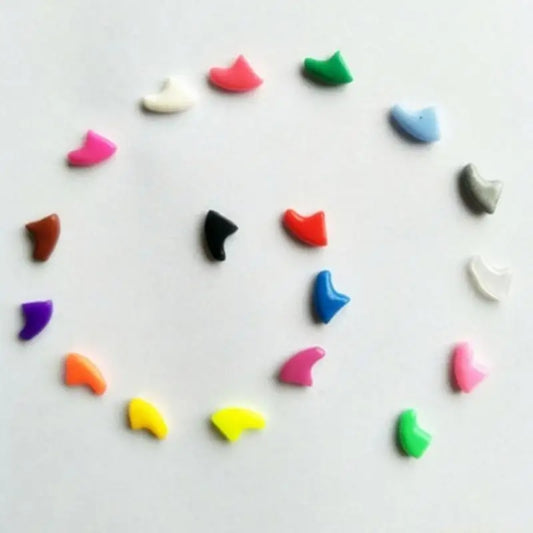 Colorful shark-shaped erasers on a white background