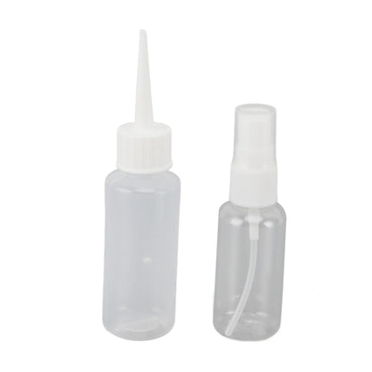 Two clear plastic bottles with white caps on a white background
