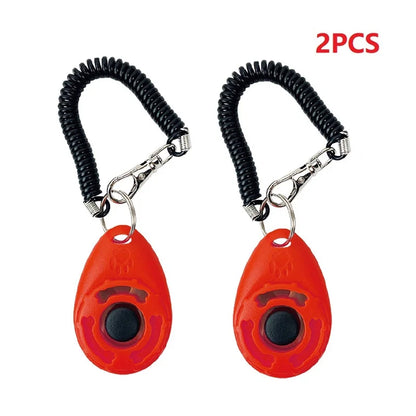 Two red dog training collars with black coils on a white background