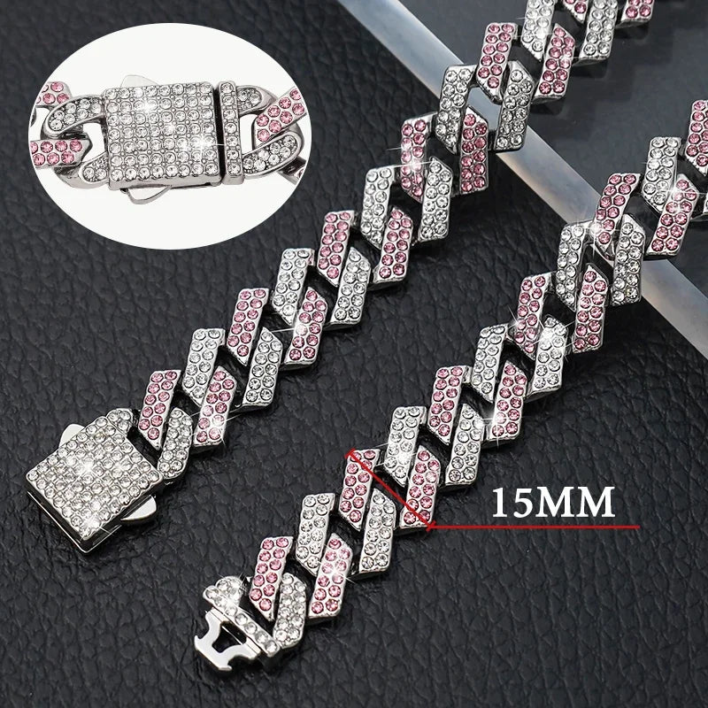 Silver and pink chain with close-up of clasp on a textured black surface