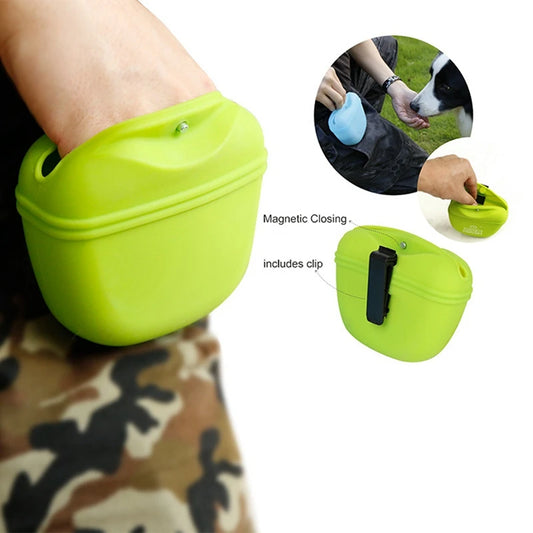 Green silicone dog bowl with magnetic closure and clip feature, worn by a person.
