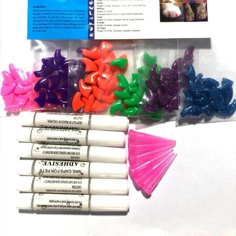 Colorful nail caps in packaging with adhesive strips and pink tabs on a white background