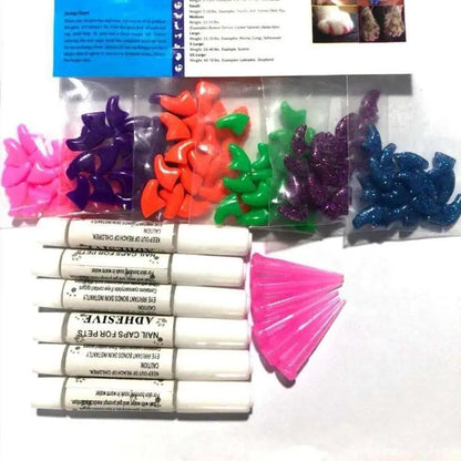 Colorful nail caps in packaging with adhesive strips and pink tabs on a white background