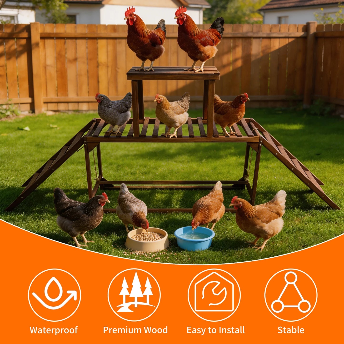 Hens on a wooden platform and ground with feeding bowls, set against a wooden fence and grassy area.