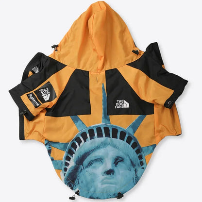 Dog coat with Statue of Liberty design and The Dog Fans branding on a white background