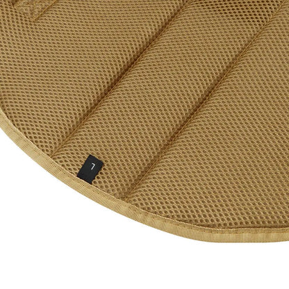Close-up of a brown quilted saddle pad with a brand label.