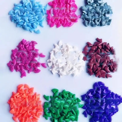 Colorful plastic flower-shaped objects on a white background