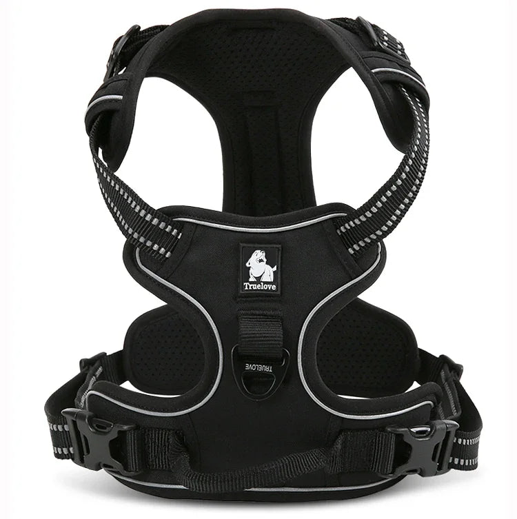 Black dog harness with reflective straps on a white background