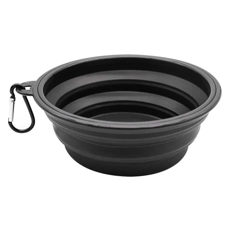 Black collapsible dog bowl with a carabiner on a white background