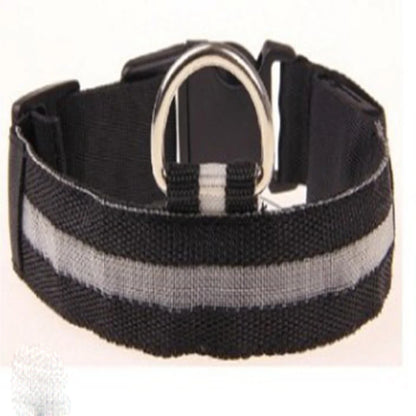 A black nylon dog collar with a wide reflective silver-gray stripe and a silver metal D-ring, shown on a plain white background.