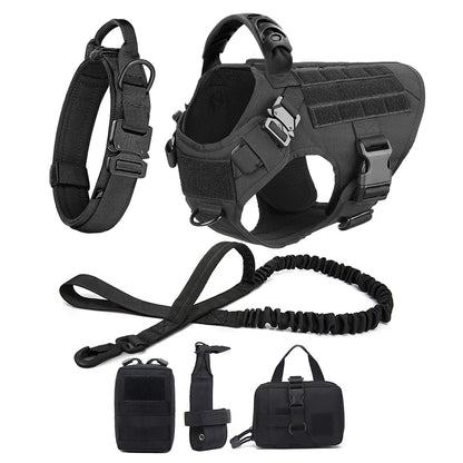 Black tactical dog harness with leash and accessories on a white background