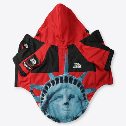 Red and black dog jacket with Statue of Liberty design on a white background