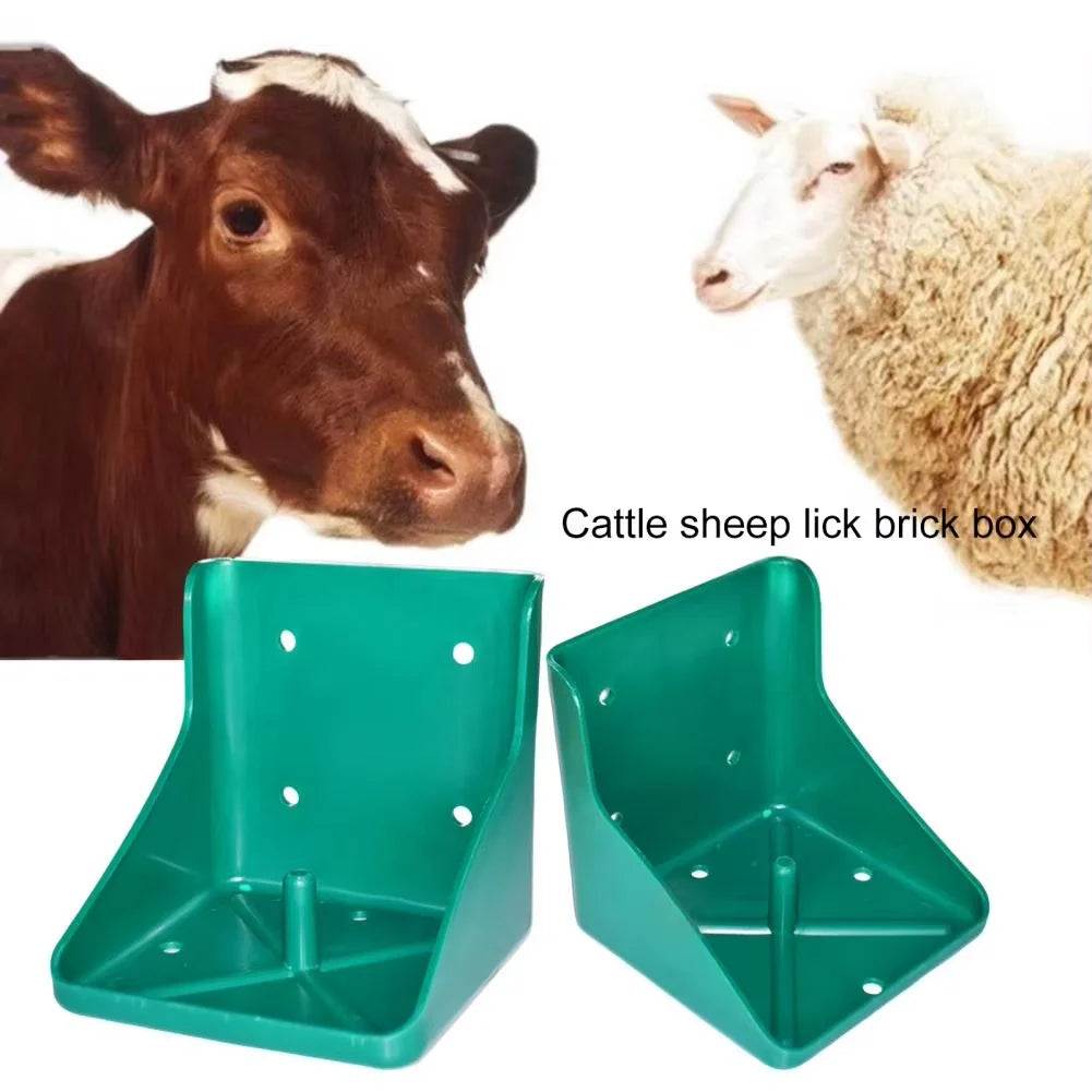 Two green plastic cattle and sheep lick brick boxes shown on a white background, with a brown-and-white cow on the left and a white sheep on the right. Text reads 'Cattle sheep lick brick box'.