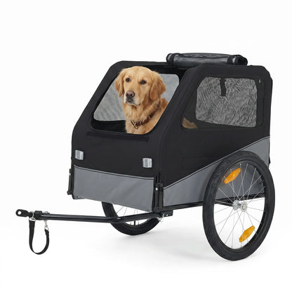 A black and gray pet trailer with mesh windows, shown on a white background with a golden retriever dog sitting inside.
