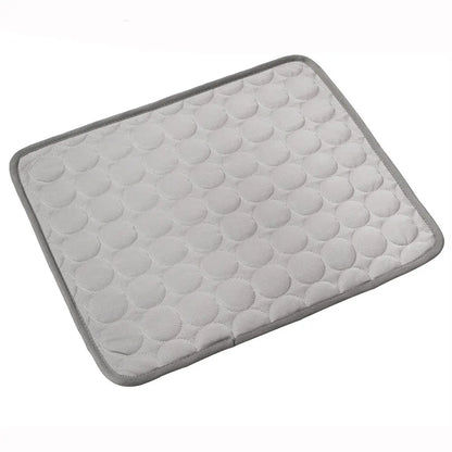 Gray bath mat with textured surface on a white background