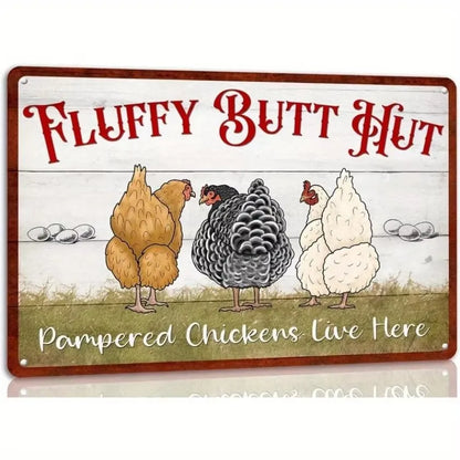 A rectangular decorative sign with rounded corners featuring the phrase 'FLUFFY BUTT HUT' in large red lettering above three illustrated chickens and the text 'Pampered Chickens Live Here' at the bottom.