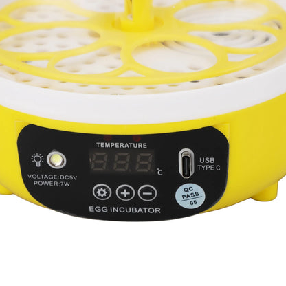 Yellow egg incubator with digital display and control buttons on a white background