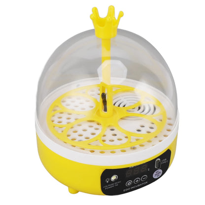 Yellow and white egg incubator with a crown-shaped top on a white background