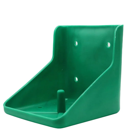 A green plastic mounting bracket or wall hook with a triangular base, three screw holes on the back panel, and a small protruding peg in the center, shown on a plain white background.