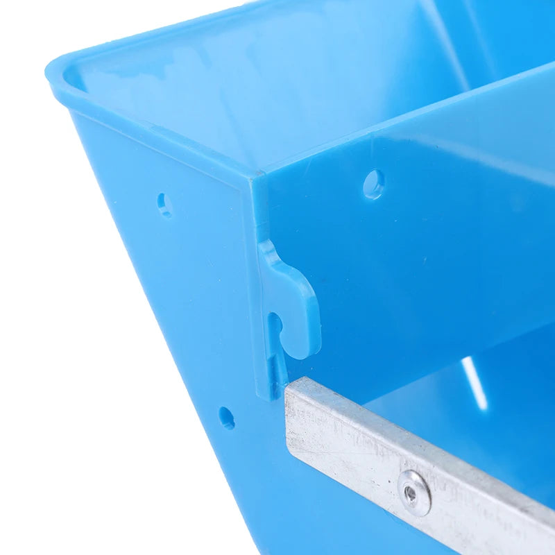 Close-up of a blue plastic bin with metal handle on a white background