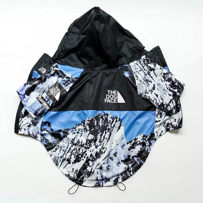 Dog coat with mountain design and 'The Dog Face' branding on a white background
