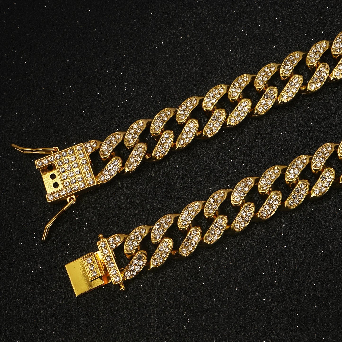 Gold chain bracelet with clasp on a black background
