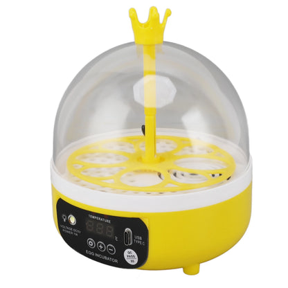 Yellow egg incubator with a clear dome on a white background