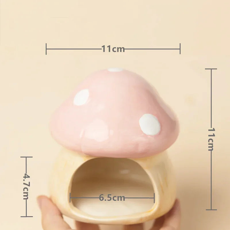 Pink and beige mushroom-shaped container with measurements on a beige background